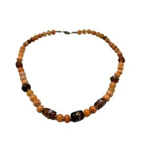 Handmade Coral Beaded Necklace with Brown Accent Beads. 22” long 11” clasped